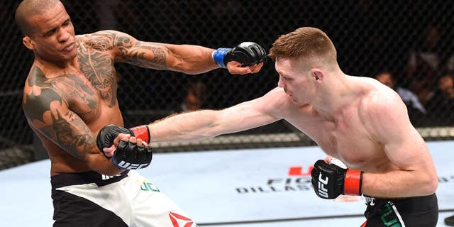 GLASGOW, SCOTLAND - JULY 18: (R-L) Joe Duffy of Ireland punches Ivan Jorge of Brazil in their lightweight fight during the UFC Fight Night event inside the SSE Hydro on July 18, 2015 in Glasgow, Scotland. (Photo by Josh Hedges/Zuffa LLC/Zuffa LLC via Getty Images)