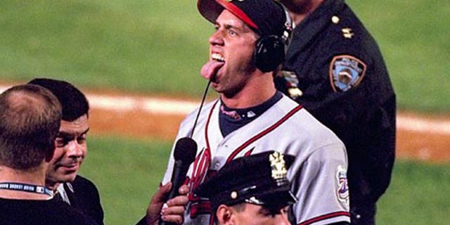 Baseball: NLCS Playoffs. Atlanta Braves John Rocker (49) taunting and gesturing fans during media interview after Game 5 vs New York Mets. Flushing, NY 10/17/1999 MANDATORY CREDIT: Al Tielemans/Sports Illustrated SetNumber: X58920
