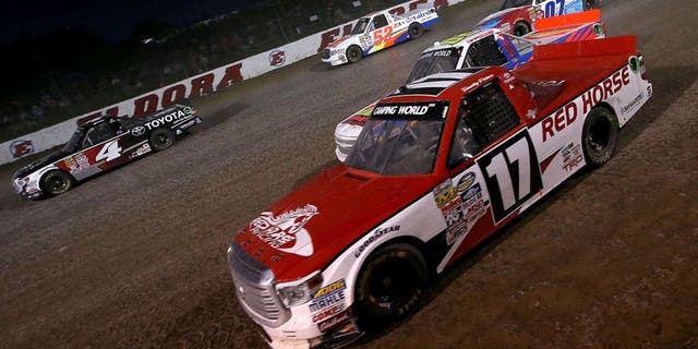 ROSSBURG, OH - JULY 22: Erik Jones, driver of the #4 Special Olympics World Games Toyota, leads a group of cars during the NASCAR Camping World Truck Series 1-800-CAR-CASH Mud Summer Classic at Eldora Speedway on July 22, 2015 in Rossburg, Ohio. (Photo by Sean Gardner/NASCAR via Getty Images)