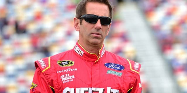 CHARLOTTE, NC - MAY 21: Greg Biffle, driver of the #16 Cheez-It Ford, walks on the grid prior to the NASCAR Sprint Cup Series Sprint Showdown at Charlotte Motor Speedway on May 21, 2016 in Charlotte, North Carolina. (Photo by Jared C. Tilton/Getty Images)