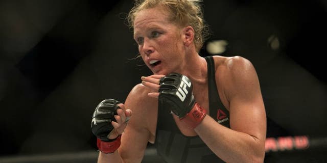 LAS VEGAS, NV - MARCH 5: (R-L) Holly Holm circles Miesha Tate during their women's bantamweight championship bout during the UFC 196 in the MGM Grand Garden Arena on March 5, 2016 in Las Vegas, Nevada. (Photo by Brandon Magnus/Zuffa LLC/Zuffa LLC via Getty Images)