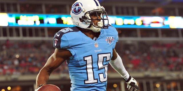 Aug 24, 2013; Nashville, TN, USA; Tennessee Titans wide receiver Justin Hunter (15) celebrates after scoring a touchdown against the Atlanta Falcons during the second half at LP Field. The Titans beat the Falcons 27-16. Mandatory Credit: Don McPeak-USA TODAY Sports