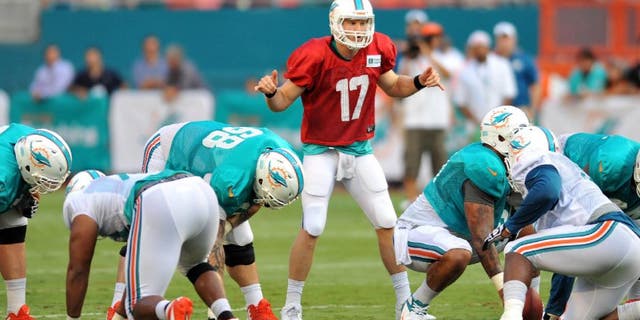 Jul 29, 2013; Miami, FL, USA; Miami Dolphins quarterback Ryan Tannehill (17) calls out plays at the line of scrimmage during a scrimmage at Sun Life Stadium. Mandatory Credit: Steve Mitchell-USA TODAY Sports