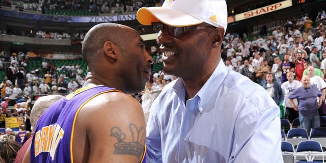 SALT LAKE CITY - MAY 8: Kobe Bryant #24 of the Los Angeles Lakers hugs his dad Joe Bryant after their win against the Utah Jazz in Game Three of the Western Conference Semifinals during the 2010 NBA Playoffs at the EnergySolutions Arena on May 8, 2010 in Salt Lake City, Utah. NOTE TO USER: User expressly acknowledges and agrees that, by downloading and/or using this Photograph, user is consenting to the terms and conditions of the Getty Images License Agreement. Mandatory Copyright Notice: Copyright 2010 NBAE (Photo by Andrew D. Bernstein/NBAE via Getty Images) *** Local Caption *** Kobe Bryant;Joe Bryant