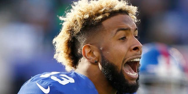 during their game at MetLife Stadium on December 20, 2015 in East Rutherford, New Jersey.,EAST RUTHERFORD, NJ - DECEMBER 20: Odell Beckham #13 of the New York Giants reacts after a scuffle in the first quarter against the Carolina Panthers during their game at MetLife Stadium on December 20, 2015 in East Rutherford, New Jersey. (Photo by Jeff Zelevansky/Getty Images)