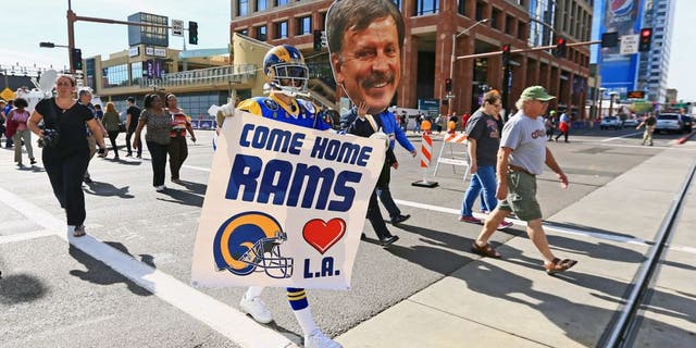 Jan 28, 2015; Phoenix, AZ, USA; St. Louis Rams super fan Mike Griffin holds a sign to move the team to Los Angeles. Mandatory Credit: Andrew Weber-USA TODAY Sports
