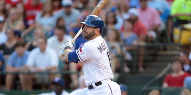 ARLINGTON, TX - JULY 3: Mitch Moreland #18 of the Texas Rangers hits in the first inning against the Los Angeles Angels of Anaheim at Rangers Ballpark in Arlington on July 3, 2015 in Arlington, Texas. (Photo by Rick Yeatts/Getty Images)