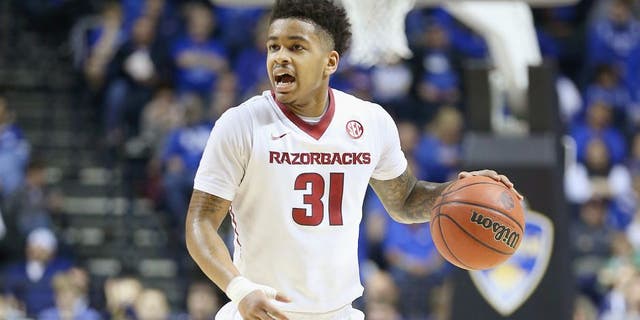 NASHVILLE, TN - MARCH 14: Anton Beard #31 of the Arkansas Razorbacks dribbles the ball in the game against the Georgia Bulldogs during the SEC Basketball Tournament Semifinals at Bridgestone Arena on March 14, 2015 in Nashville, Tennessee. (Photo by Andy Lyons/Getty Images)