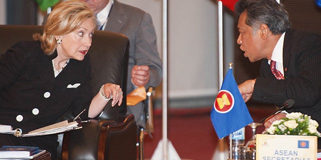 July 23: Secretary of State Hillary Clinton speaks with ASEAN Secretary Surin Pitsuwan during 17th ASEAN Regional forum Retreat meeting in Hanoi.