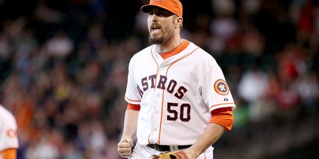 Jul 12, 2014; Houston, TX, USA; Houston Astros relief pitcher Chad Qualls (50) celebrates after defeating the Boston Red Sox 3-2 at Minute Maid Park. Mandatory Credit: Andrew Richardson-USA TODAY Sports