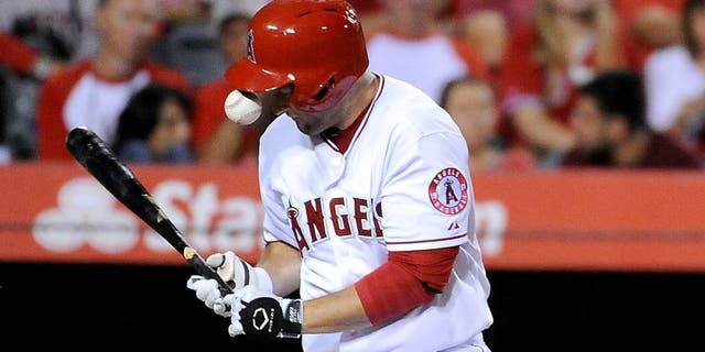 ANAHEIM, CA - JULY 22: David Freese #6 of the Los Angeles Angels of Anaheim is hit in the hand by a ball in the fourth inning during a game against the Minnesota Twins at Angel Stadium of Anaheim on July 22, 2015 in Anaheim, California. (Photo by Jonathan Moore/Getty Images)