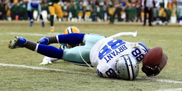 Jan 11, 2015; Green Bay, WI, USA; Dallas Cowboys wide receiver Dez Bryant (88) is unable to catch a pass against Green Bay Packers cornerback Sam Shields (37) in the fourth quarter in the 2014 NFC Divisional playoff football game at Lambeau Field. Mandatory Credit: Andrew Weber-USA TODAY Sports