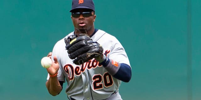CLEVELAND, OH - JUNE 24: Center fielder Rajai Davis #20 of the Detroit Tigers fields a ground ball hit by Francisco Lindor #12 of the Cleveland Indians during the third inning at Progressive Field on June 24, 2015 in Cleveland, Ohio. (Photo by Jason Miller/Getty Images)
