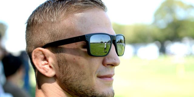 ALAMEDA, CA - AUGUST 26: UFC bantamweight champion TJ Dillashaw attends Oakland Raiders practice at the their training facility on August 26, 2014 in Alameda, California. (Photo by Jeff Bottari/Zuffa LLC/Zuffa LLC via Getty Images) *** Local Caption ***TJ Dillashaw