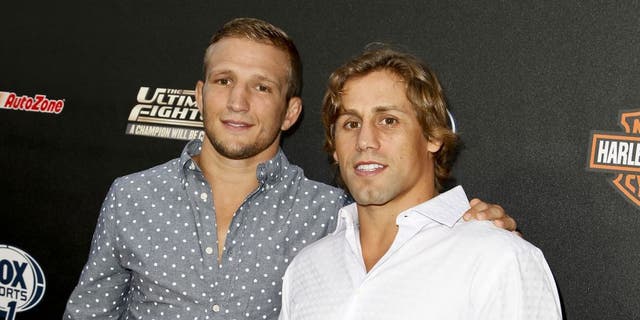 HOLLYWOOD, CA - SEPTEMBER 09: (L-R) TJ Dillashaw and Urijah Faber attend FOX Sports 1's 'The Ultimate Fighter' season premiere party at Lure on September 9, 2014 in Hollywood, California. (Photo by Tibrina Hobson/WireImage)