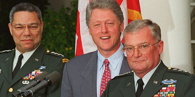 In this Aug. 11, 1993 file photo, Army Gen. John Shalikashvili speaks in the Rose Garden of the White House in Washington accompanied by President Bill Clinton and Joint Chiefs Chairman Gen. Colin Powell.