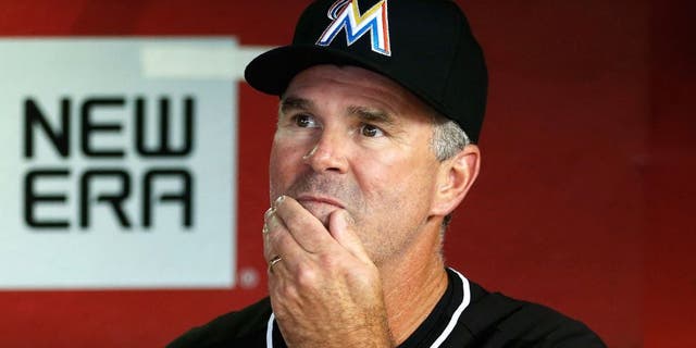 PHOENIX, AZ - JULY 21: Manager Dan Jennings #26 of the Miami Marlins watches from the dugout during the MLB game against the Arizona Diamondbacks at Chase Field on July 21, 2015 in Phoenix, Arizona. (Photo by Christian Petersen/Getty Images)