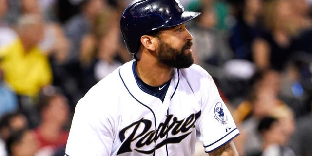 SAN DIEGO, CA - JULY 23: Matt Kemp #27 of the San Diego Padres tosses his bat after hitting a long fly ball during the fourth inning of a baseball game against the Miami Marlins at Petco Park July 23, 2015 in San Diego, California. (Photo by Denis Poroy/Getty Images)
