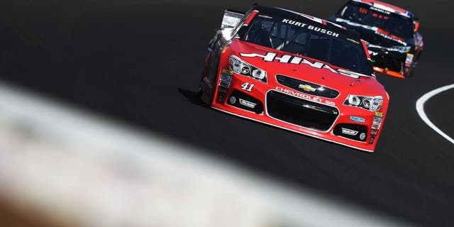 INDIANAPOLIS, IN - JULY 24: Kurt Busch, driver of the #41 Haas Automation Chevrolet, leads Denny Hamlin, driver of the #11 FedEx Express Toyota, during practice for the NASCAR Sprint Cup Series Crown Royal Presents the Jeff Kyle 400 at the Brickyard at Indianapolis Motorspeedway on July 24, 2015 in Indianapolis, Indiana. (Photo by Rainier Ehrhardt/NASCAR via Getty Images)