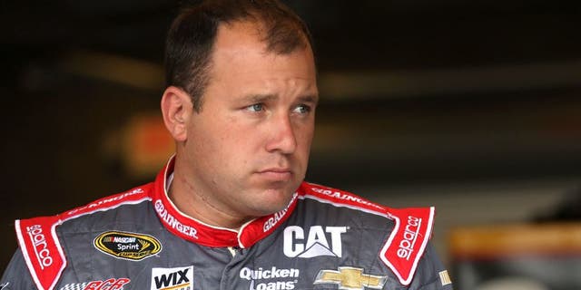INDIANAPOLIS, IN - JULY 24: Ryan Newman, driver of the #31 Grainger Chevrolet, stands in the garage area during practice for the NASCAR Sprint Cup Series Crown Royal Presents the Jeff Kyle 400 at the Brickyard at Indianapolis Motorspeedway on July 24, 2015 in Indianapolis, Indiana. (Photo by Chris Graythen/Getty Images)