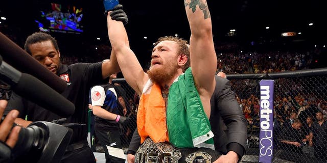 LAS VEGAS, NV - JULY 11: Conor McGregor reacts to his victory in their UFC interim featherweight title fight during the UFC 189 event inside MGM Grand Garden Arena on July 11, 2015 in Las Vegas, Nevada. (Photo by Josh Hedges/Zuffa LLC/Zuffa LLC via Getty Images)