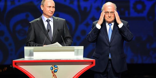 SAINT PETERSBURG, RUSSIA - JULY 25: Vladimir Putin, President of Russia and FIFA President Joseph S. Blatter speak during the Preliminary Draw of the 2018 FIFA World Cup in Russia at The Konstantin Palace on July 25, 2015 in Saint Petersburg, Russia. (Photo by Shaun Botterill/Getty Images)