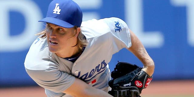 Jul 26, 2015; New York City, NY, USA; Los Angeles Dodgers starting pitcher Zack Greinke (21) pitches during the first inning against the New York Mets at Citi Field. Mandatory Credit: Anthony Gruppuso-USA TODAY Sports