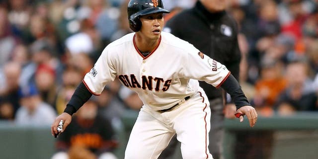 SAN FRANCISCO, CA - JUNE 15: Base runner Nori Aoki #23 of the San Francisco Giants watches play from first base in the second inning against the Seattle Mariners at AT&T Park on June 15, 2015 in San Francisco, California. (Photo by Lachlan Cunningham/Getty Images)