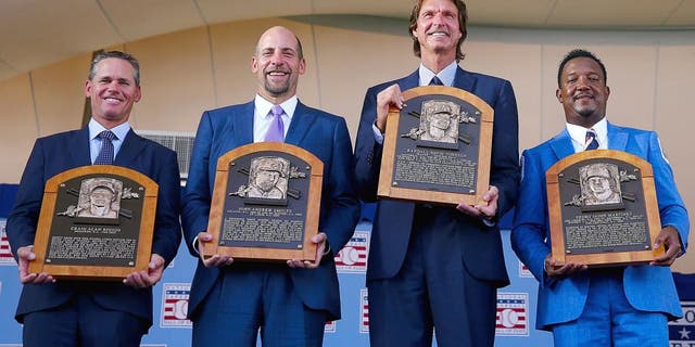 COOPERSTOWN, NY - JULY 26: 2015 Inductees Craig Biggio,John Smoltz,Randy Johnson and Pedro Martinez pose with their plaques after the Induction Ceremony at National Baseball Hall of Fame on July 26, 2015 in Cooperstown, New York. (Photo by Elsa/Getty Images)
