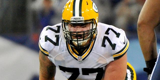 NASHVILLE, TN - AUGUST 09: Aaron Adams #77 of the Green Bay Packers plays against the Tennessee Titans at LP Field on August 9, 2014 in Nashville, Tennessee. (Photo by Frederick Breedon/Getty Images)