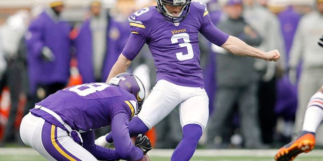 Dec 28, 2014; Minneapolis, MN, USA; Minnesota Vikings kicker Blair Walsh (3) kicks a 37 yard field goal as punter Jeff Locke (18) holds in the first quarter against the Chicago Bears at TCF Bank Stadium. Mandatory Credit: Bruce Kluckhohn-USA TODAY Sports