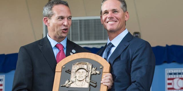 Jul 26, 2015; Cooperstown, NY, USA; Hall of Fame President Jeff Idelson (L) presents Hall of Fame Inductee Craig Biggio (R) with his Hall of Fame Plague during the Hall of Fame Induction Ceremonies at Clark Sports Center. Mandatory Credit: Gregory J. Fisher-USA TODAY Sports