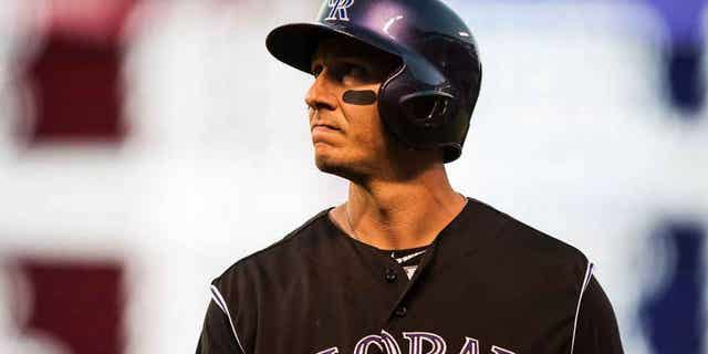 DENVER, CO - JULY 25: Troy Tulowitzki #2 of the Colorado Rockies reacts after flying out in the seventh inning of a game against the Cincinnati Reds at Coors Field on July 25, 2015 in Denver, Colorado. (Photo by Dustin Bradford/Getty Images)
