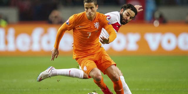 (L-R) Ibrahim Afellay of Holland, Selcuk Inan of Turkye during the UEFA Euro 2016 qualifying match between Netherlands and Turkey on March 28, 2015 at the Amsterdam Arena at Amsterdam, The Netherlands.(Photo by VI Images via Getty Images)