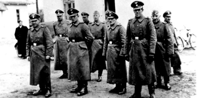 FILE: Nazi guards are seen at the Belzec death camp in Poland in 1942. Samuel Kunz, 90, a suspected former Nazi guard at Belzec, has been charged with participating in the murder of 430,000 Jews and other crimes during the Third Reich.