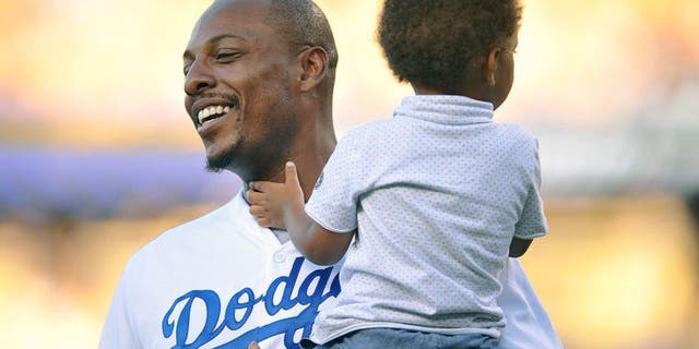 July 28, 2015; Los Angeles, CA, USA; Los Angeles Clippers forward Paul Pierce in attendance with son Prince before the Los Angeles Dodgers play against the Oakland Athletics at Dodger Stadium. Mandatory Credit: Gary A. Vasquez-USA TODAY Sports