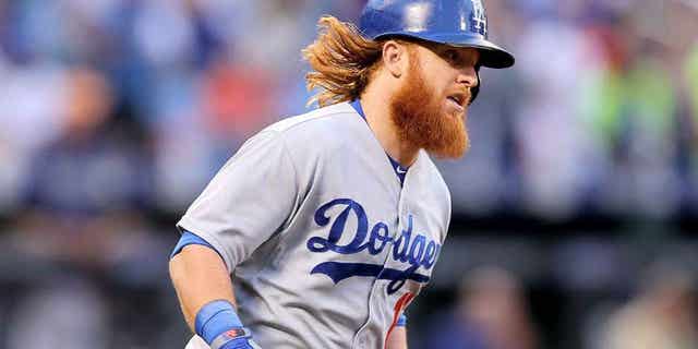 NEW YORK, NY - JULY 24: Justin Turner #10 of the Los Angeles Dodgers rounds first base after he hit a solo home run in the third inning against the New York Mets on July 24, 2015 at Citi Field in the Flushing neighborhood of the Queens borough of New York City. (Photo by Elsa/Getty Images)