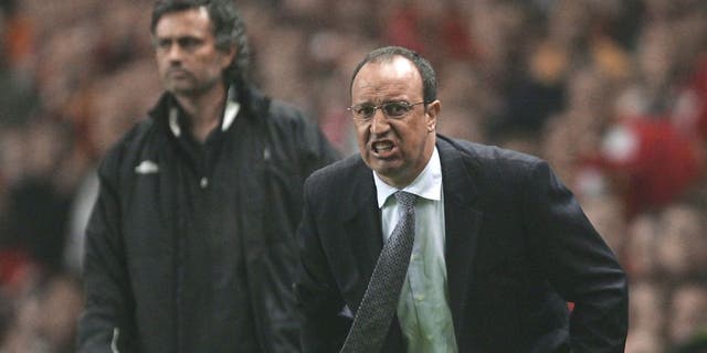 LIVERPOOL, ENGLAND - MAY 3: Jose Mourinho the manager of Chelsea and Rafael Benitez the manager of Liverpool shout instructions to their players during the Champions League semi final second leg match between Liverpool and Chelsea at Anfield on May 3, 2005 in Liverpool, England. (Photo by Alex Livesey/Getty Images)