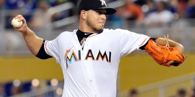 Jul 28, 2015; Miami, FL, USA; Miami Marlins starting pitcher Jose Fernandez (16) delivers a pitch against the Washington Nationals during the first inning at Marlins Park. Mandatory Credit: Steve Mitchell-USA TODAY Sports