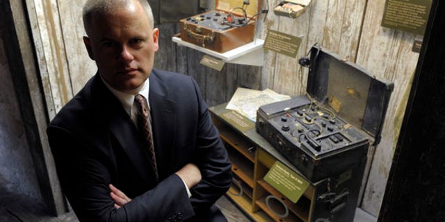 July 28: Mark Stout, a historian at the International Spy Museum, stands near spy radios used during World War II and the Cold War. Stout is an expert on one of America's most secretive espionage agencies, known simply as the Pond.