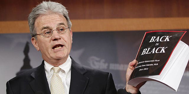July 18: Sen. Tom Coburn, R-Okla. reveals his "Back in Black" plan to reduce the federal deficit during a news conference on Capitol Hill in Washington.