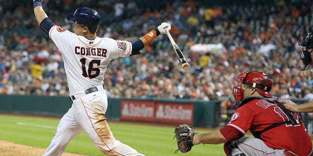 Jul 28, 2015; Houston, TX, USA; Houston Astros catcher Hank Conger (16) hits a double against the Los Angeles Angels in the sixth inning at Minute Maid Park. Astros won 10-5. Mandatory Credit: Thomas B. Shea-USA TODAY Sports