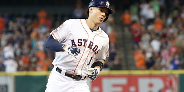 Jul 28, 2015; Houston, TX, USA; Houston Astros shortstop Carlos Correa (1) rounds the bases after hitting a home run against the Los Angeles Angels in the first inning at Minute Maid Park. Mandatory Credit: Thomas B. Shea-USA TODAY Sports