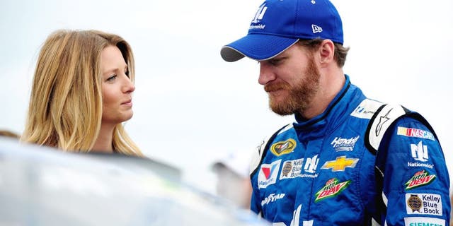SPARTA, KY - JULY 11: Dale Earnhardt Jr., driver of the #88 Nationwide Chevrolet, right, takes part in pre-race ceremonies with fiancee Amy Reimann prior to the NASCAR Sprint Cup Series Quaker State 400 presented by Advance Auto Parts at Kentucky Speedway on July 11, 2015 in Sparta, Kentucky. (Photo by Jeff Curry/Getty Images)