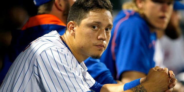 Jul 29, 2015; New York City, NY, USA; New York Mets shortstop Wilmer Flores (4) dejected in the dugout during game against the San Diego Padres at Citi Field. Mandatory Credit: Noah K. Murray-USA TODAY Sports