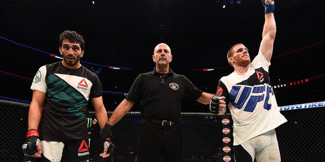 CHICAGO, IL - JULY 25: Andrew Holbrook (R) reacts after his split-decision victory over Ramsey Nijem in their lightweight bout during the UFC event at the United Center on July 25, 2015 in Chicago, Illinois. (Photo by Jeff Bottari/Zuffa LLC/Zuffa LLC via Getty Images)