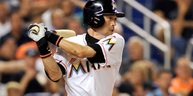 Jul 28, 2015; Miami, FL, USA; Miami Marlins left fielder Ichiro Suzuki (51) connects for a base hit during the fifth inning against the Washington Nationals at Marlins Park. Mandatory Credit: Steve Mitchell-USA TODAY Sports