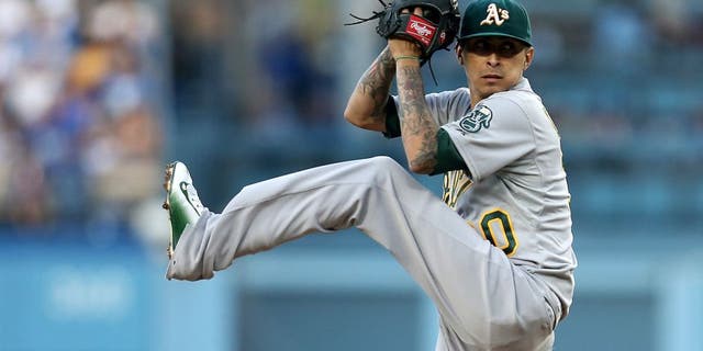 LOS ANGELES, CA - JULY 29: Jesse Chavz #30 of the Oakland Athletics throws a pitch against the Los Angeles Dodgers at Dodger Stadium on July 29, 2015 in Los Angeles, California. (Photo by Stephen Dunn/Getty Images)