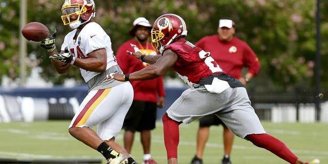 Jul 30, 2015; Richmond, VA, USA; Washington Redskins tight end Niles Paul (84) catches the ball in front of Redskins defensive back Duke Ihenacho (24) during drills as part of afternoon practice on day one of training camp at the Washington Redskins Bon Secours Training Center. Mandatory Credit: Geoff Burke-USA TODAY Sports