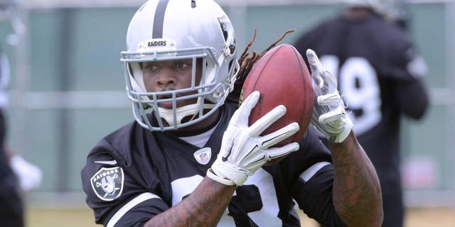 May 26, 2015; Alameda, CA, USA; Oakland Raiders running back Trent Richardson (33) catches a pass at organized team activities at the Raiders practice facility. Mandatory Credit: Kirby Lee-USA TODAY Sports